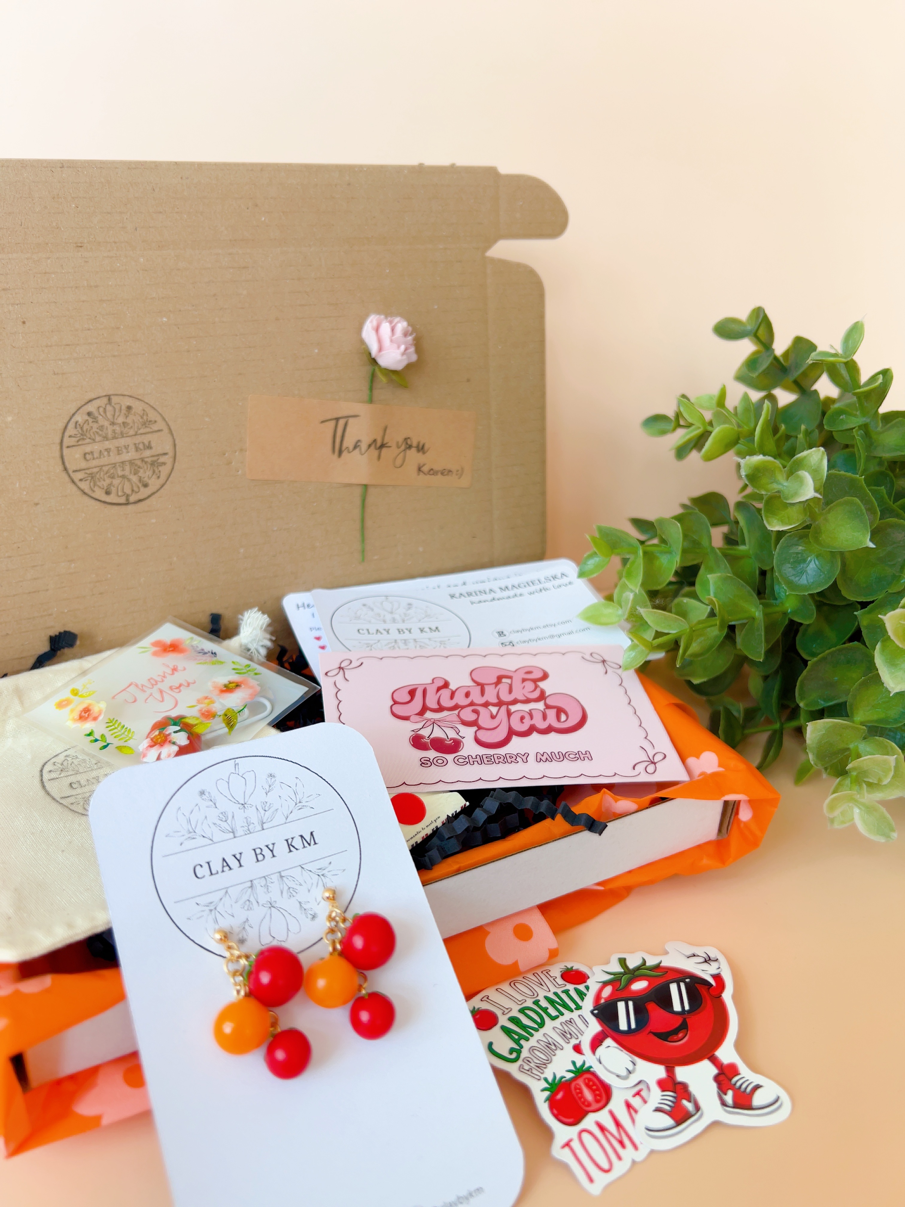 Beautifully packed Clay by KM order with branded thank-you card, tomato earrings and decorative extras - gift-ready handmade jewellery packaging